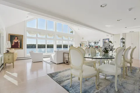 a view of a dining room with furniture wooden floor and a rug