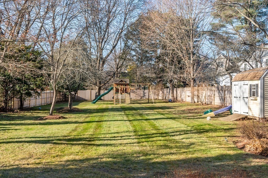 374 Weston Road Wellesley, MA 02482 - Photo 3 of 21 a view of a swimming pool with trees in the background