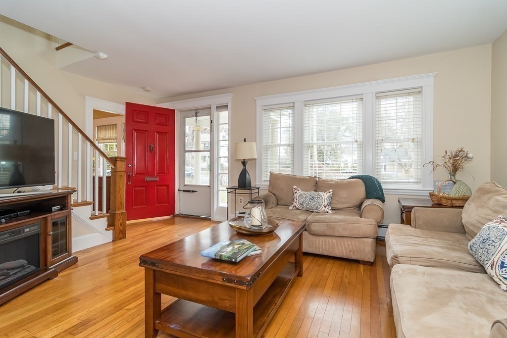 374 Weston Road Wellesley, MA 02482 - Photo 5 of 21 a living room with fireplace furniture and a flat screen tv