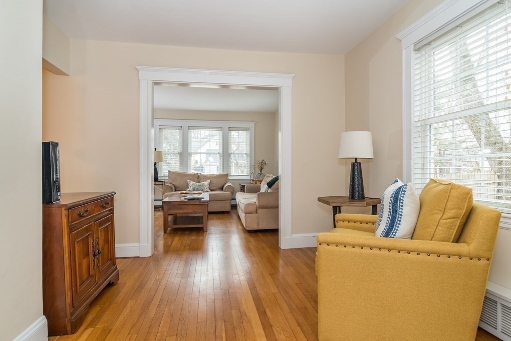 374 Weston Road Wellesley, MA 02482 - Photo 7 of 21 a living room with furniture and a wooden floor