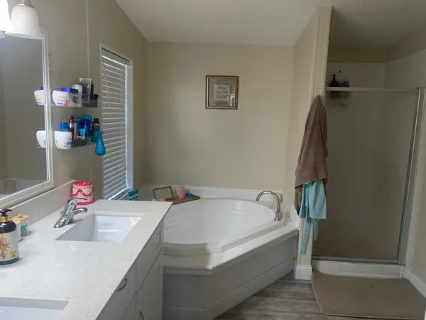 a bathroom with a sink and a bath tub