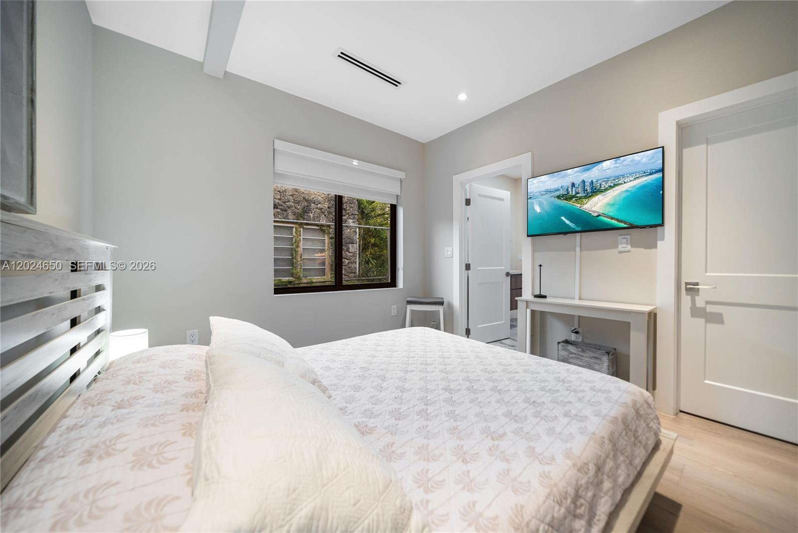 1663 Southwest 13th Street Miami, FL 33145 - Photo 35 of 112 a bedroom with a bed and a flat screen tv