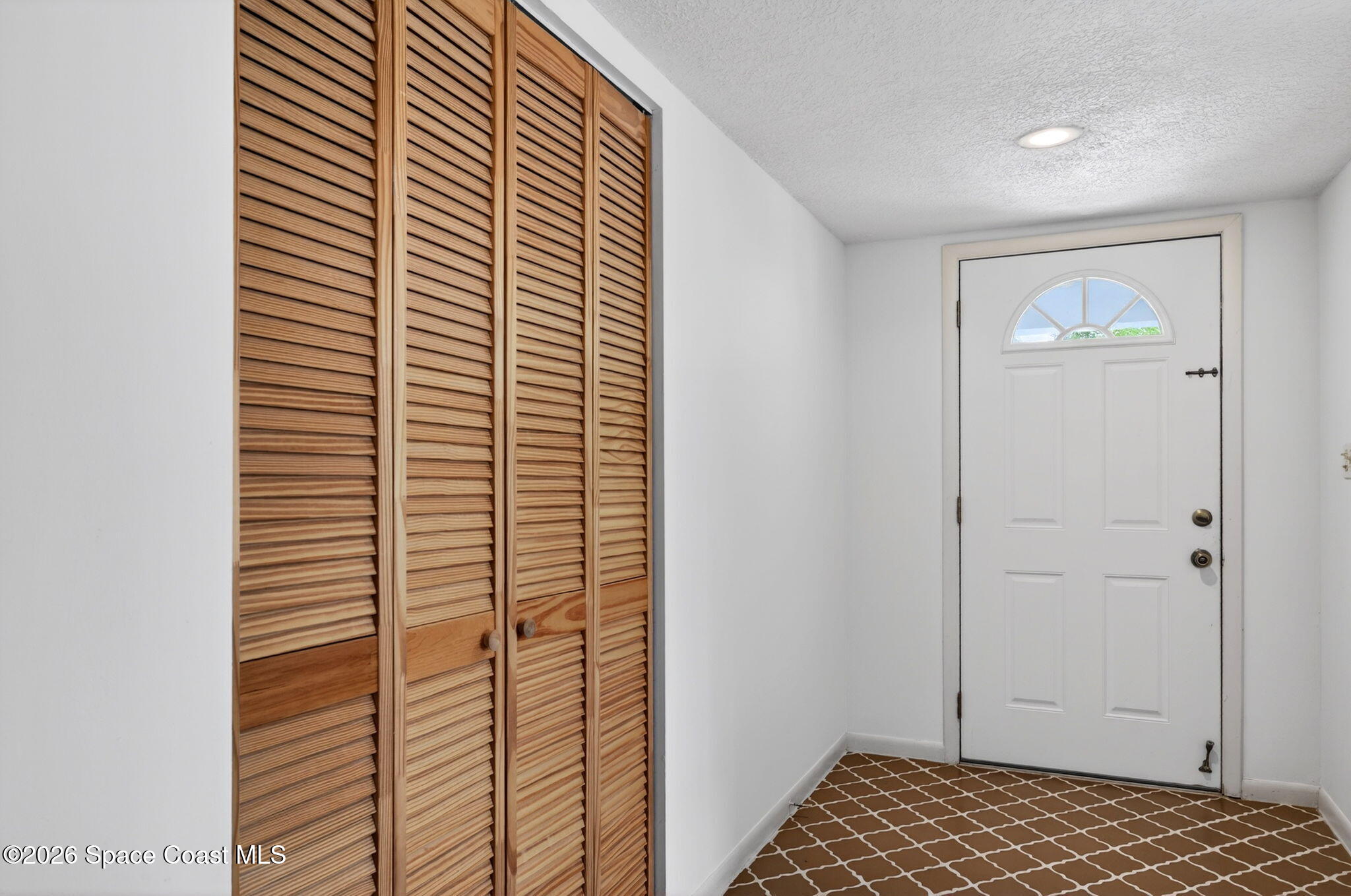 956 Waialae Circle Northeast Palm Bay, FL 32905 - Photo 13 of 45 a view of bathroom with shower and a gate
