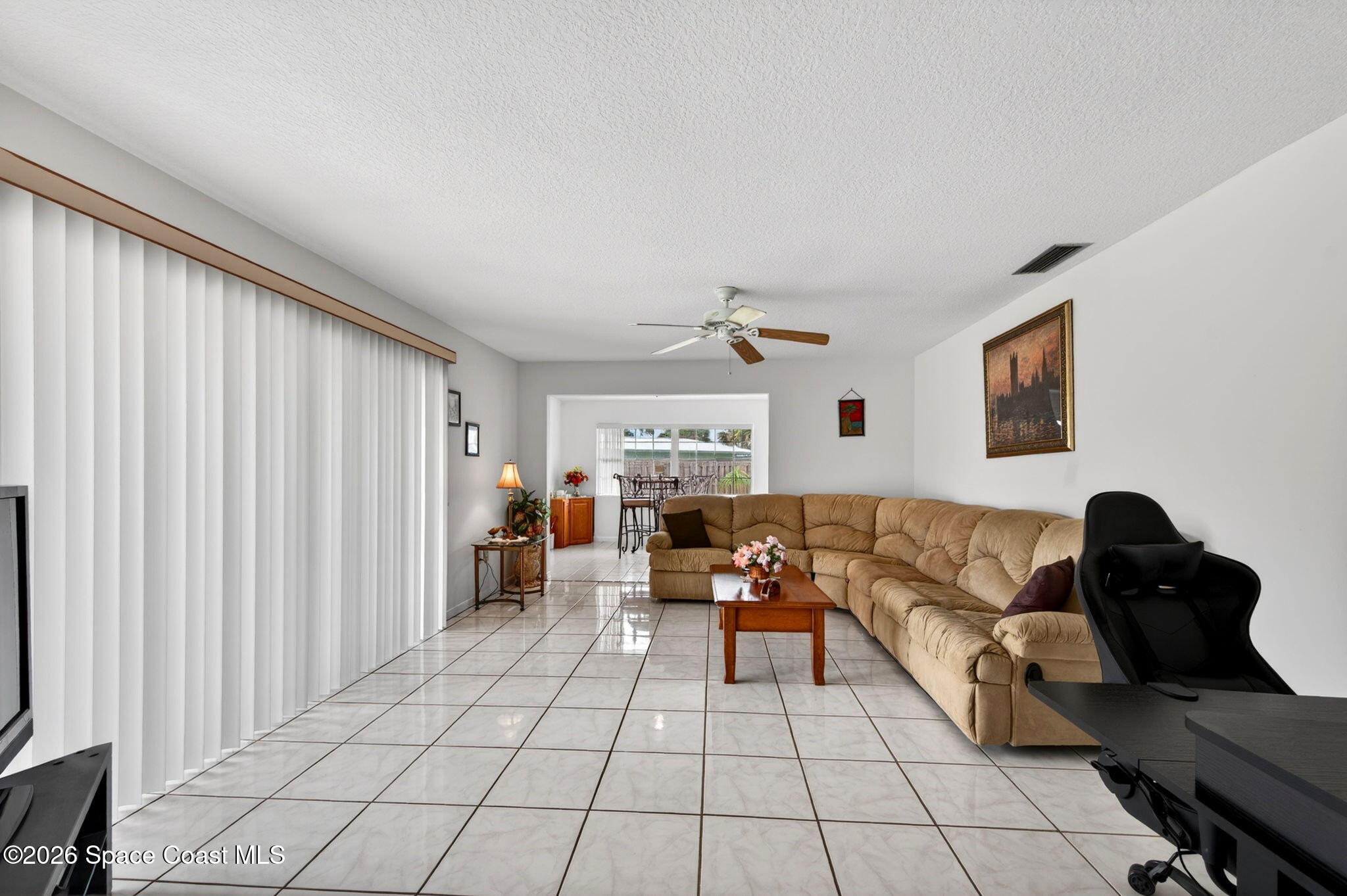 956 Waialae Circle Northeast Palm Bay, FL 32905 - Photo 14 of 45 a living room with furniture