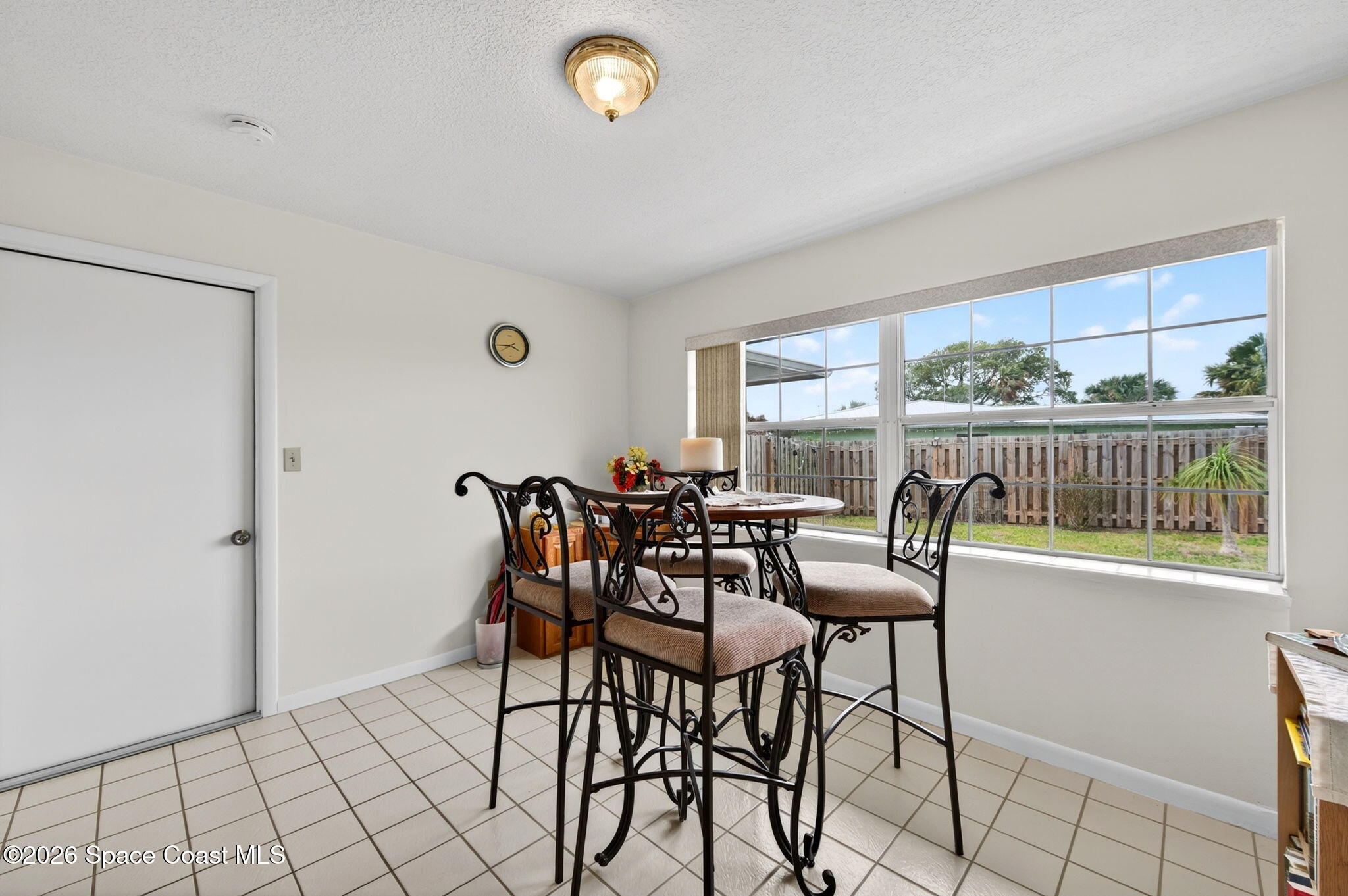 956 Waialae Circle Northeast Palm Bay, FL 32905 - Photo 17 of 45 a view of a dining room with furniture window and outside view