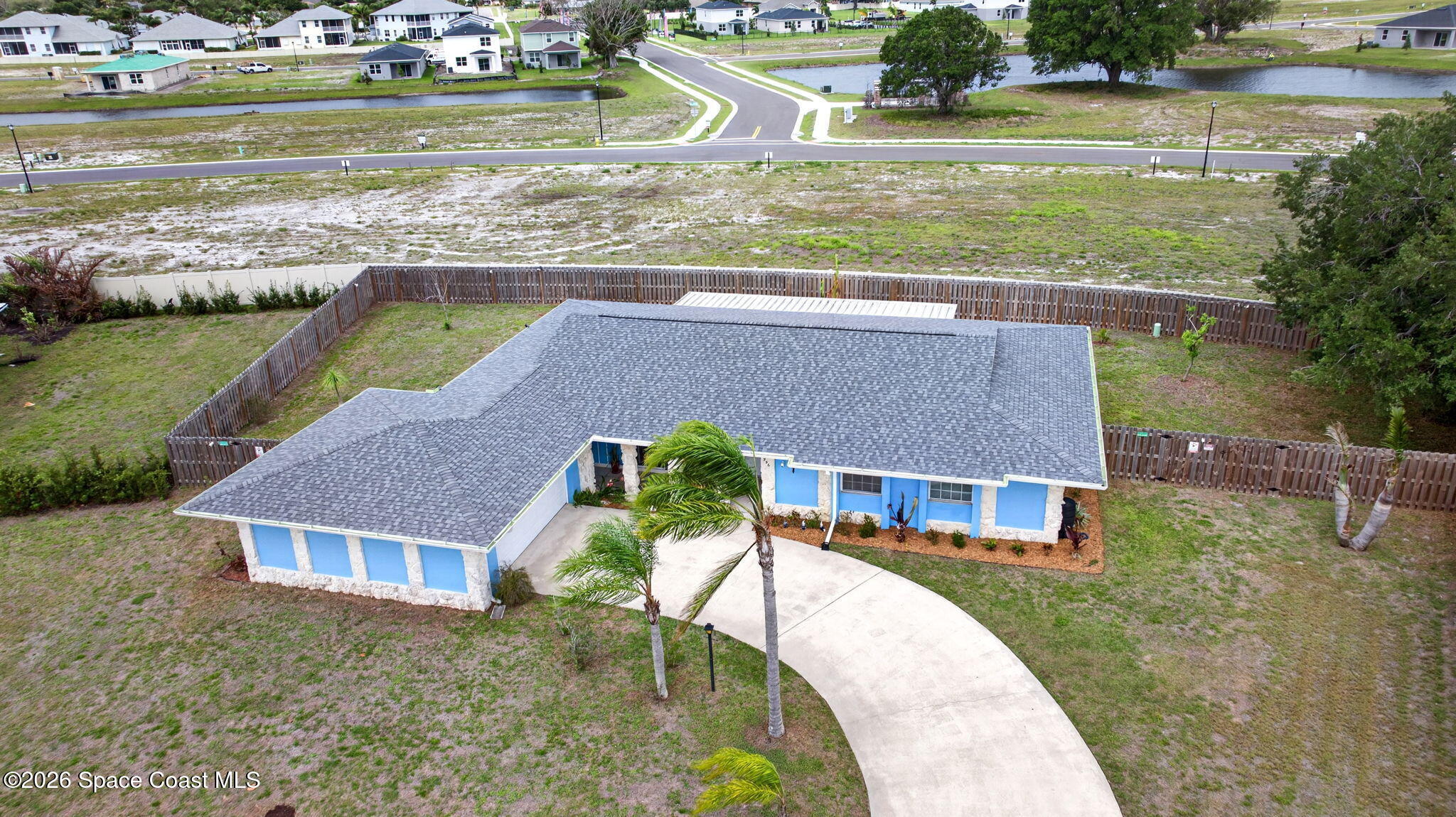 956 Waialae Circle Northeast Palm Bay, FL 32905 - Photo 2 of 45 front view of a house with a yard