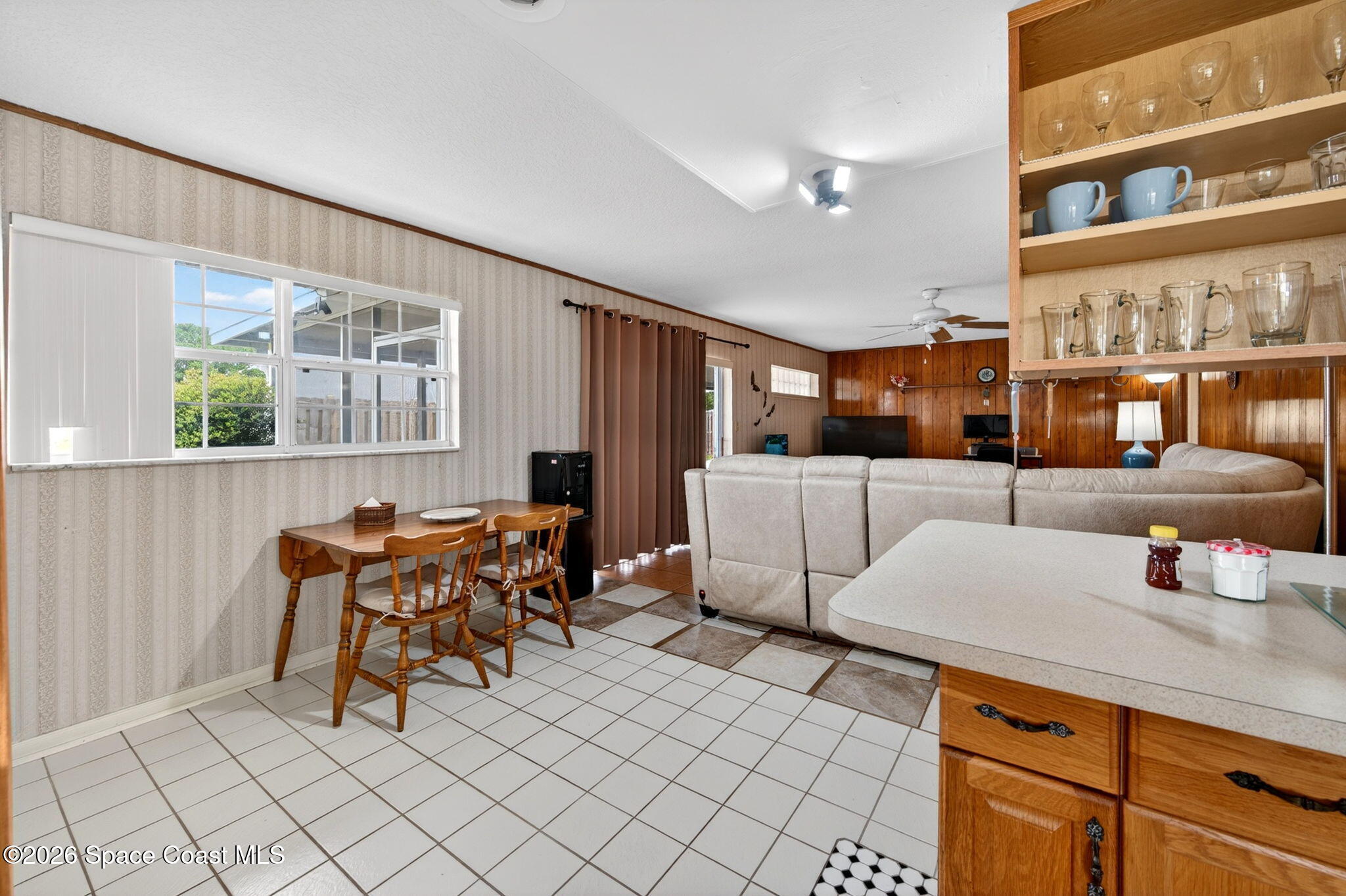 956 Waialae Circle Northeast Palm Bay, FL 32905 - Photo 21 of 45 a outdoor space with a large window and couch