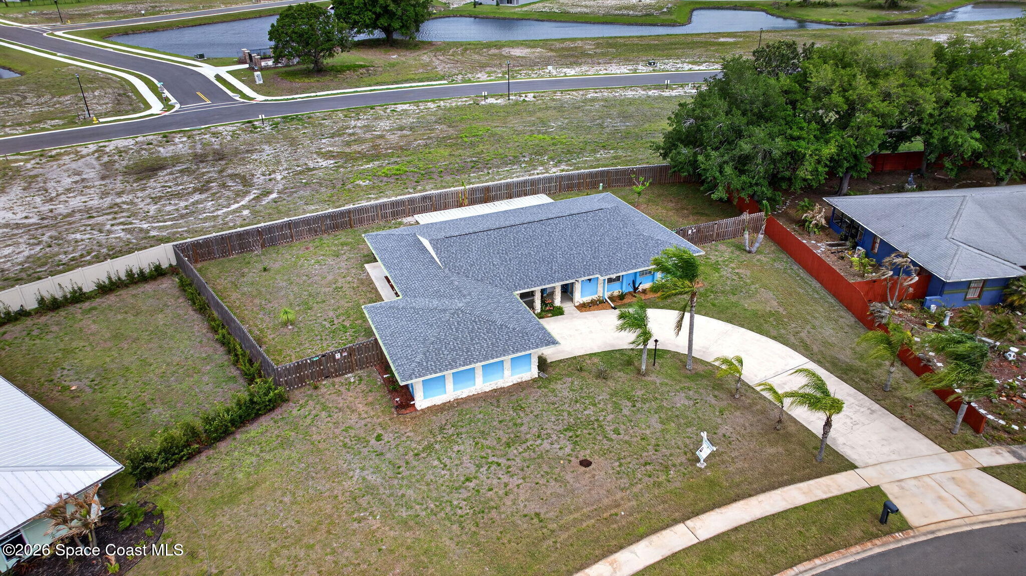 956 Waialae Circle Northeast Palm Bay, FL 32905 - Photo 3 of 45 a view of a house with a yard