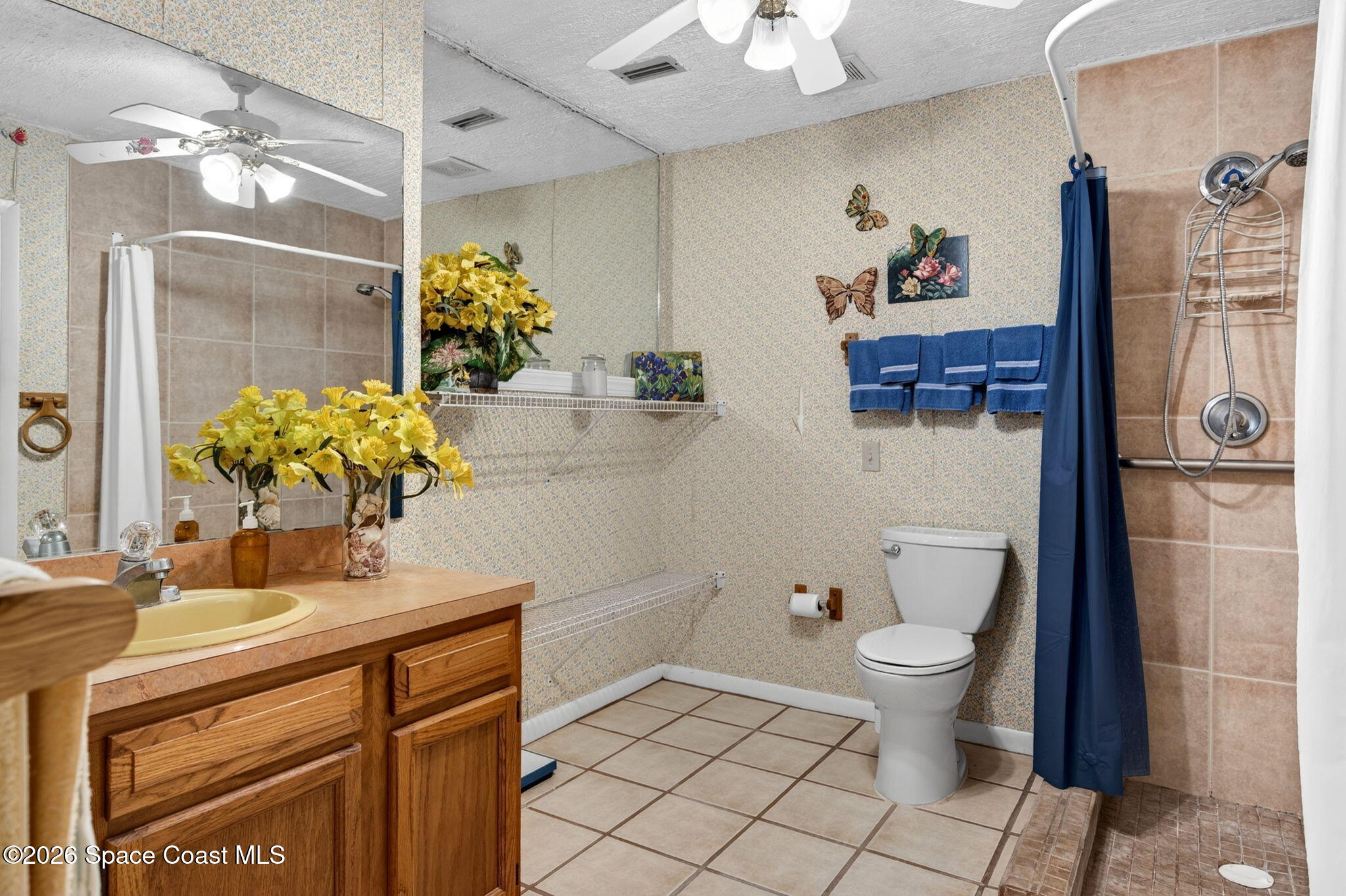 956 Waialae Circle Northeast Palm Bay, FL 32905 - Photo 32 of 45 a bathroom with a sink toilet and shower