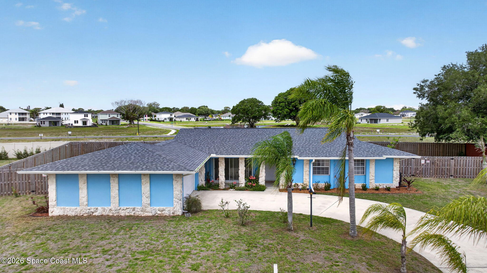 956 Waialae Circle Northeast Palm Bay, FL 32905 - Photo 4 of 45 a front view of house with a garden