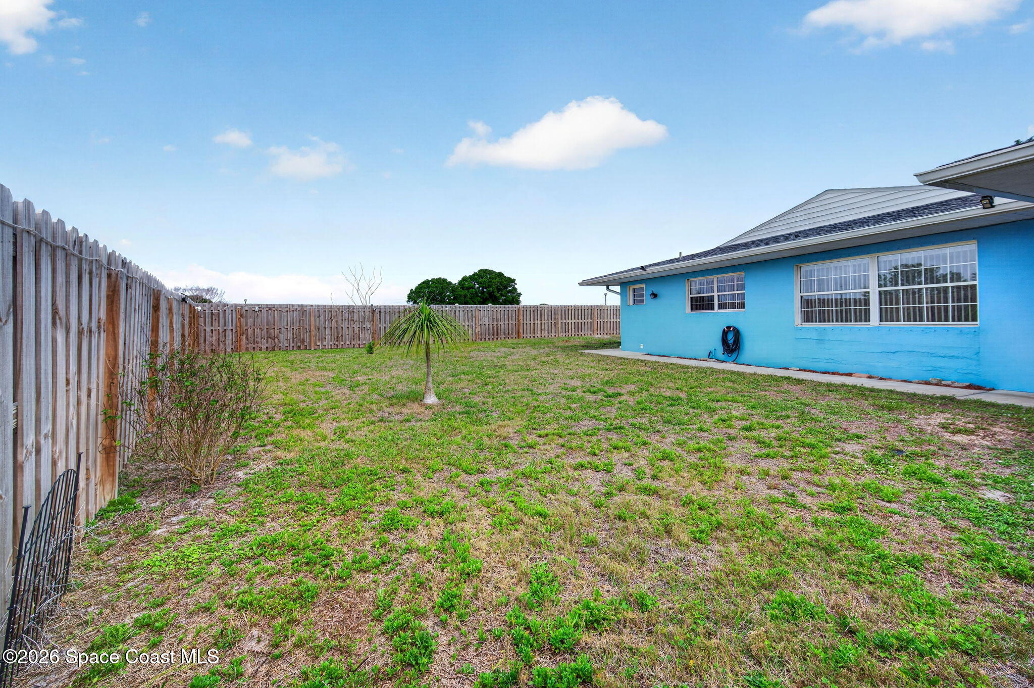 956 Waialae Circle Northeast Palm Bay, FL 32905 - Photo 42 of 45 a house view with a garden space