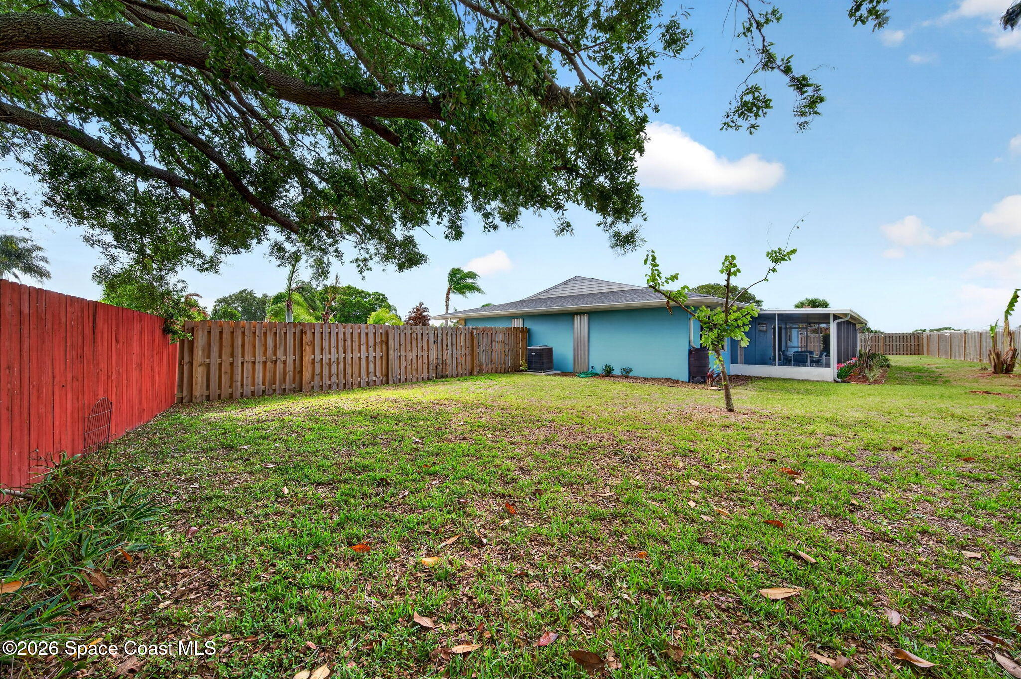 956 Waialae Circle Northeast Palm Bay, FL 32905 - Photo 44 of 45 a front view of a house with garden