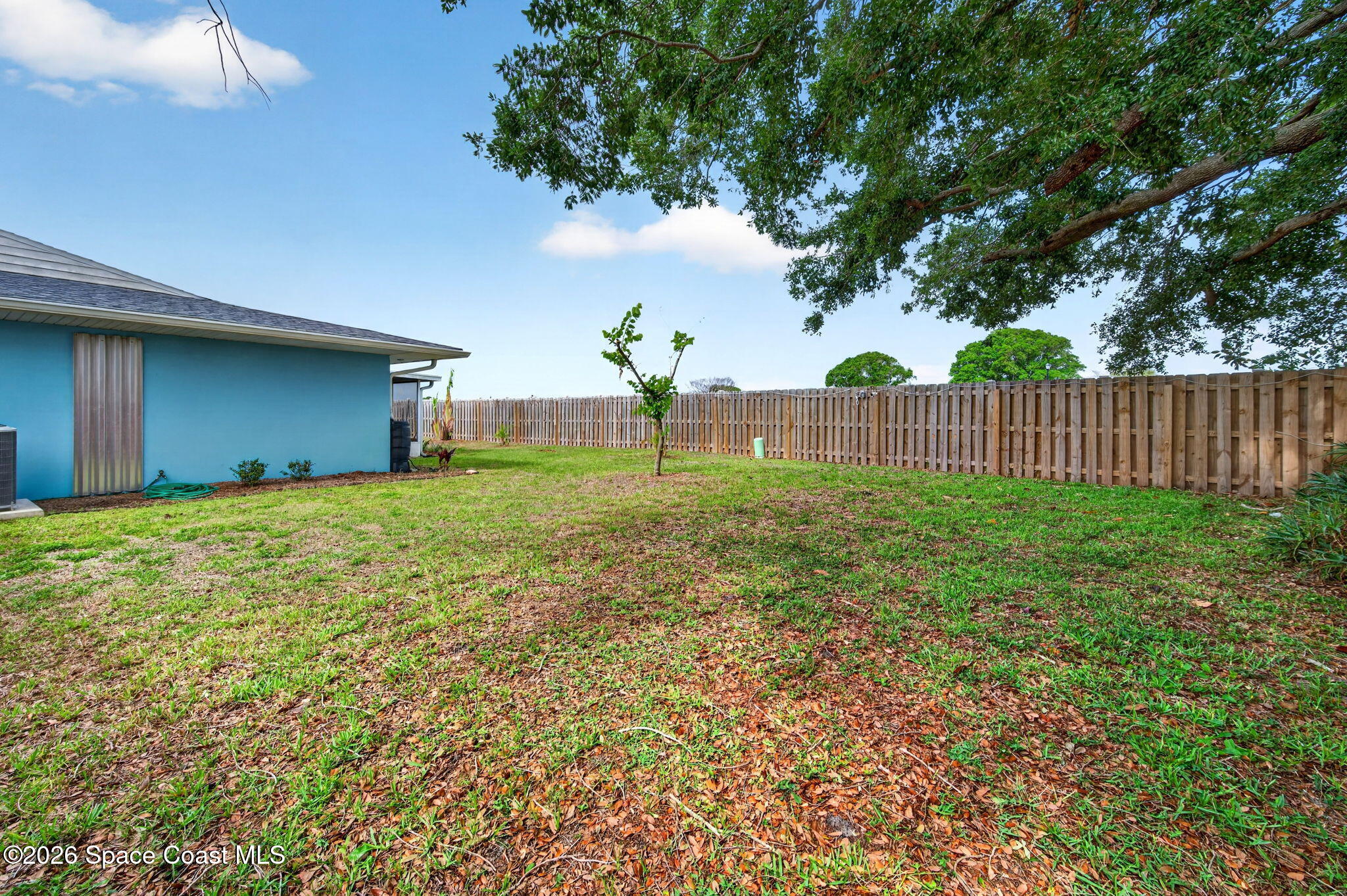 956 Waialae Circle Northeast Palm Bay, FL 32905 - Photo 45 of 45 a house view with garden space