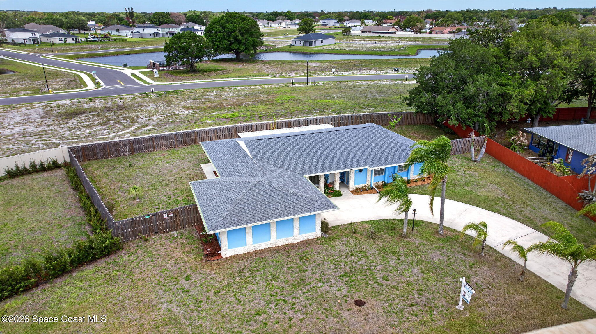 956 Waialae Circle Northeast Palm Bay, FL 32905 - Photo 6 of 45 an aerial view of a house