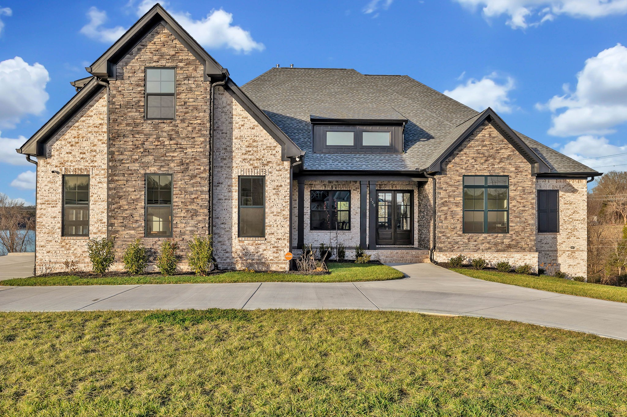 a front view of a house with a yard