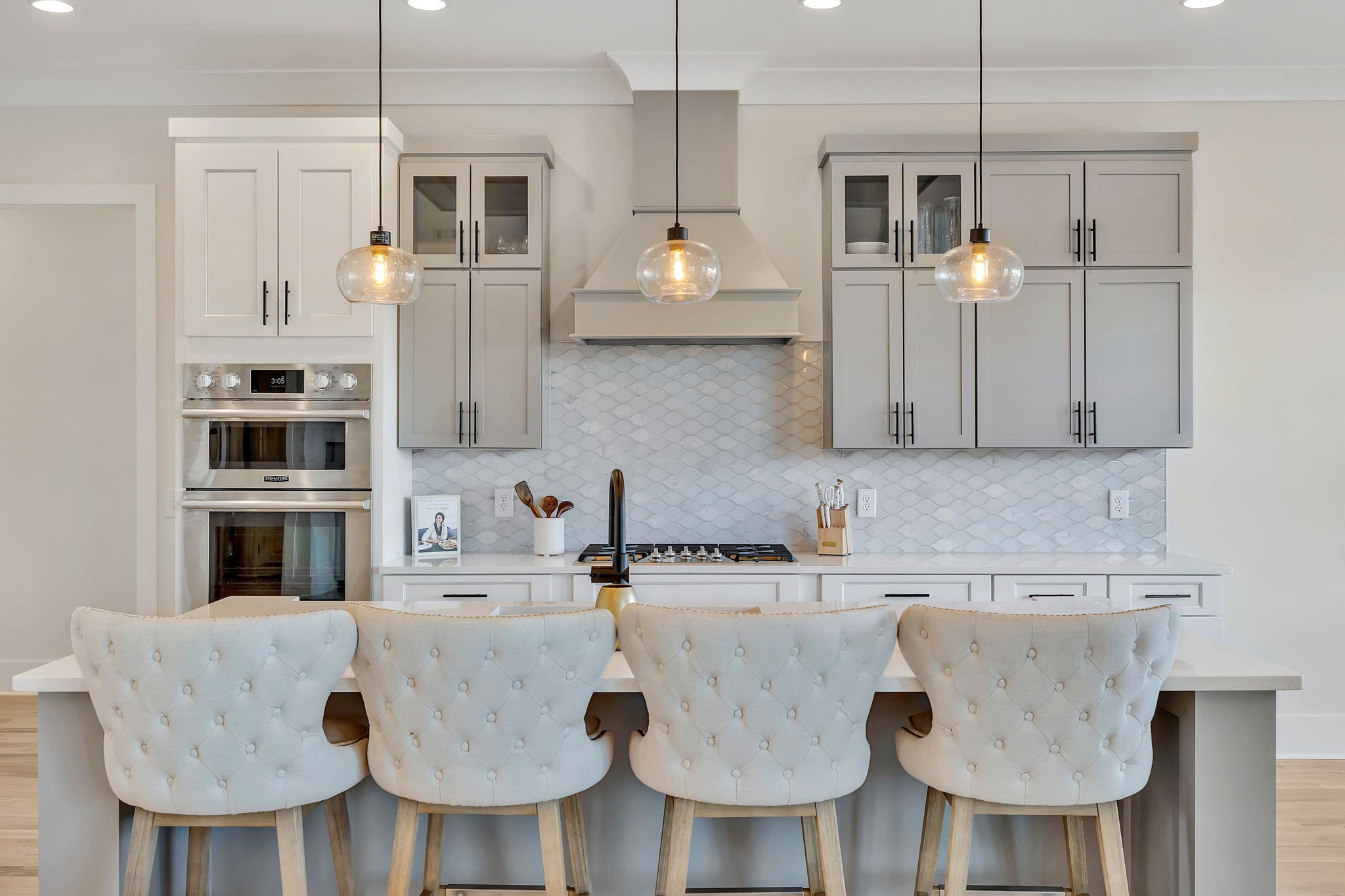 159 Kathryn Adele Lane Mount Juliet, TN 37122 - Photo 26 of 68 a kitchen with stainless steel appliances granite countertop a sink a stove a dining table and chairs