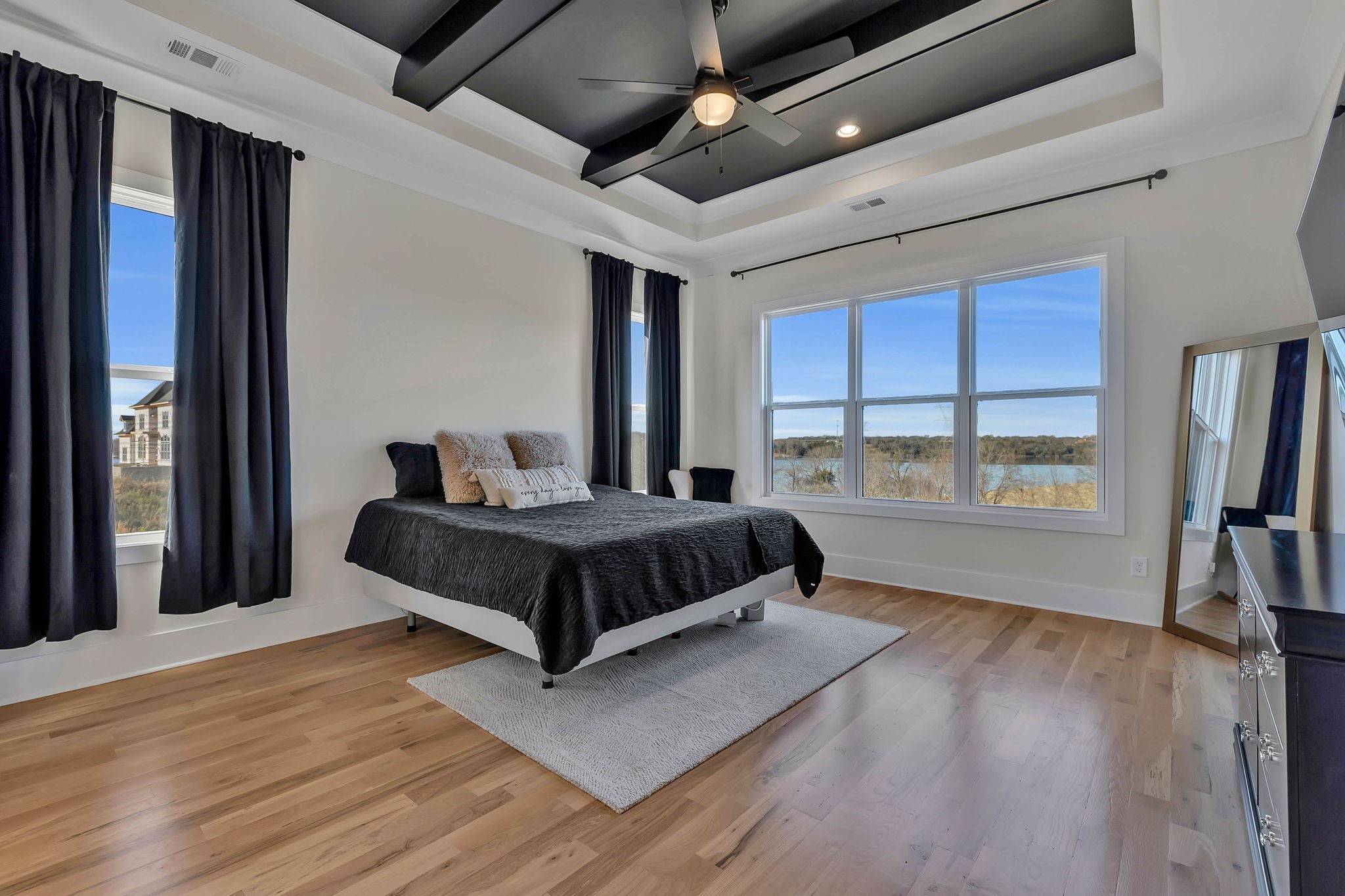 159 Kathryn Adele Lane Mount Juliet, TN 37122 - Photo 28 of 68 a bedroom with a large bed a flat tv screen and a closet