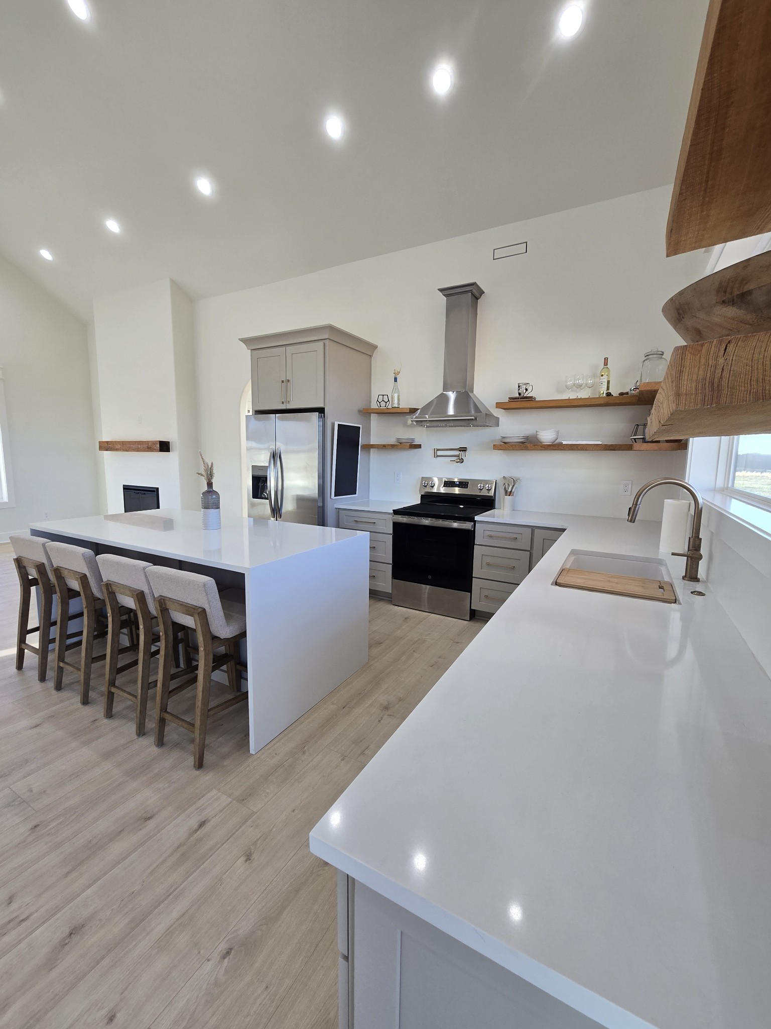 6784 Shelbyville Road Morrison, TN 37357 - Photo 25 of 48 a large kitchen with kitchen island a stove a sink a dining table and chairs