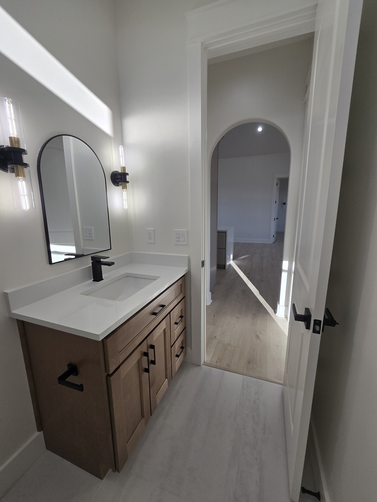 6784 Shelbyville Road Morrison, TN 37357 - Photo 32 of 48 a bathroom with a sink a vanity and mirror