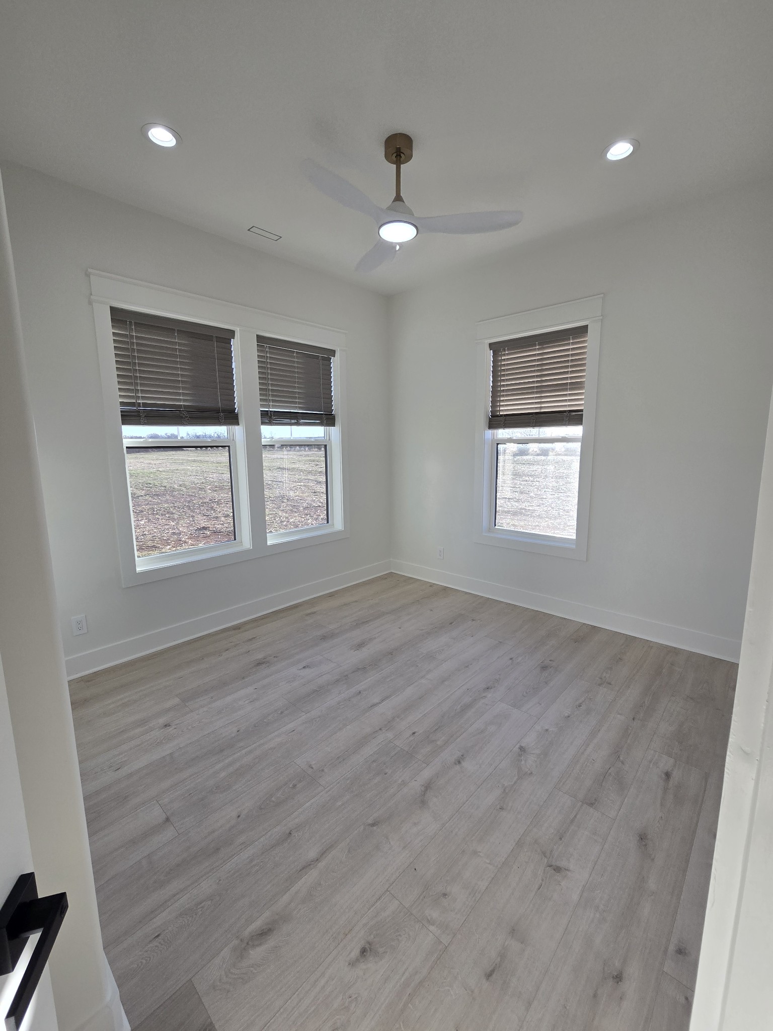 6784 Shelbyville Road Morrison, TN 37357 - Photo 37 of 48 a view of an empty room with a window and wooden floor