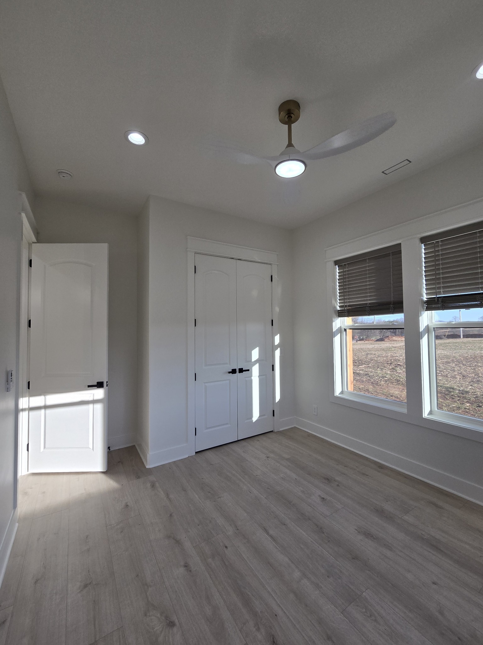 6784 Shelbyville Road Morrison, TN 37357 - Photo 38 of 48 a view of an empty room with a window and wooden floor