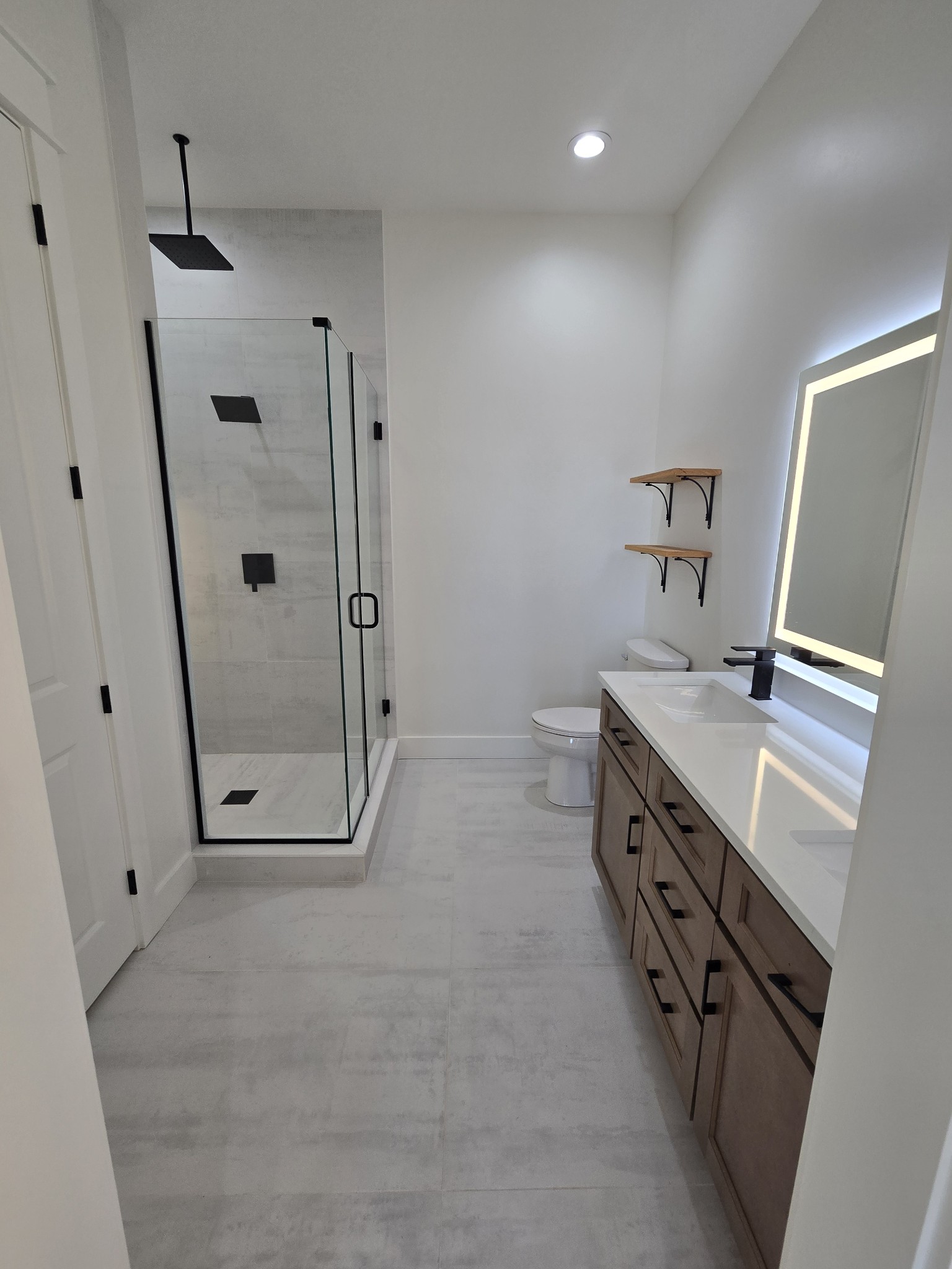 6784 Shelbyville Road Morrison, TN 37357 - Photo 42 of 48 a bathroom with double vanity and a mirror