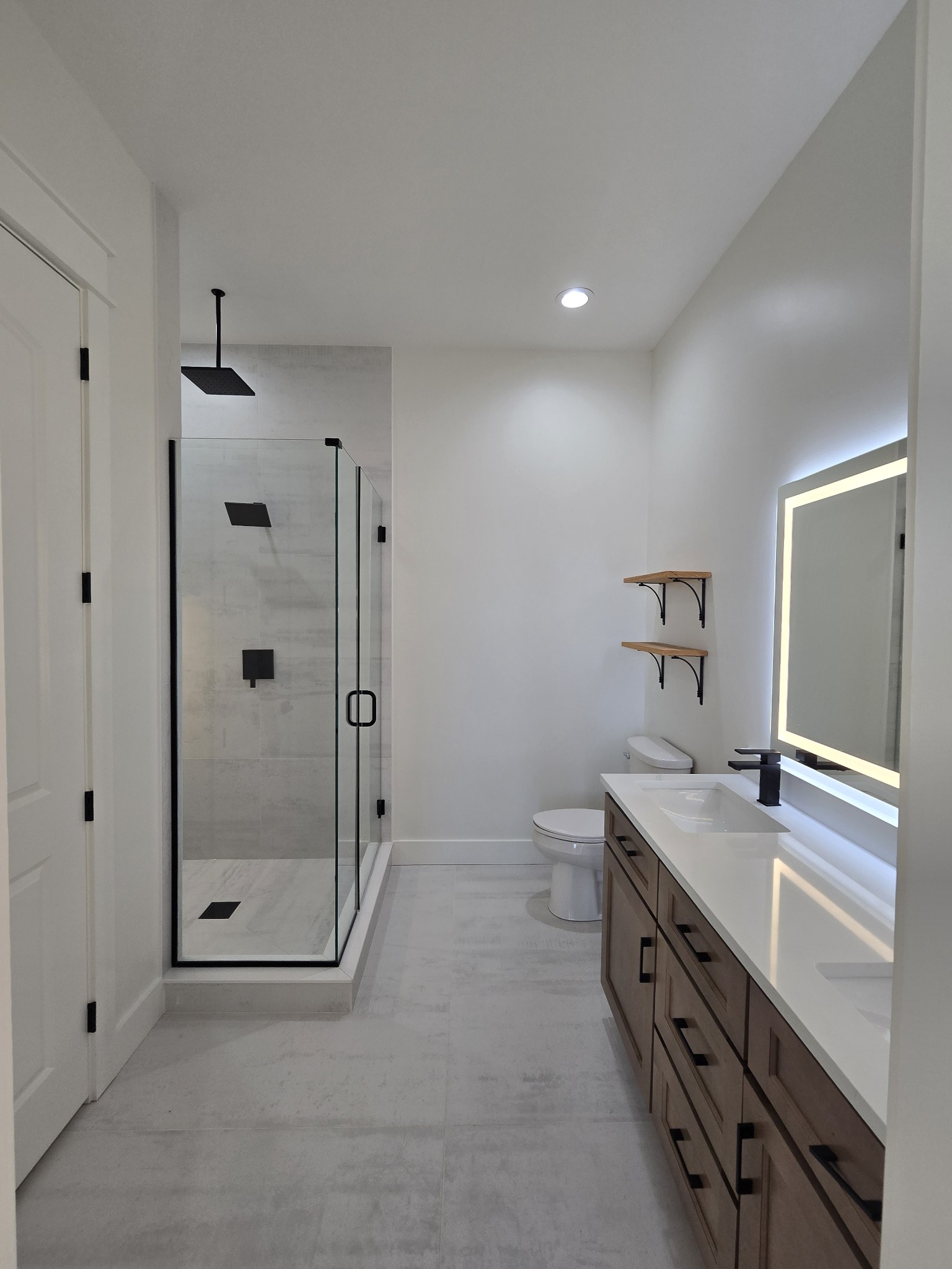 6784 Shelbyville Road Morrison, TN 37357 - Photo 43 of 48 a bathroom with a shower sink and mirror