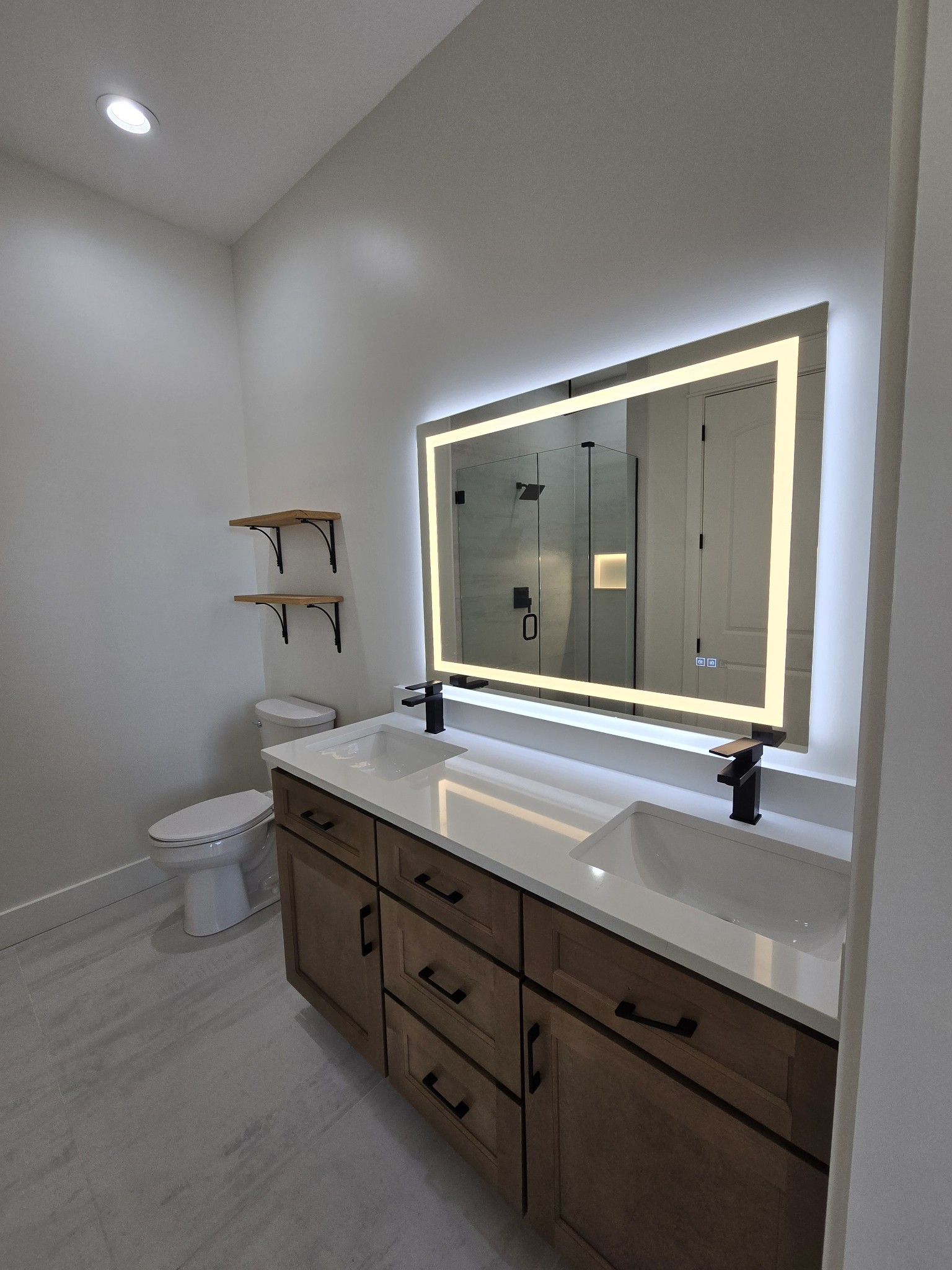 6784 Shelbyville Road Morrison, TN 37357 - Photo 44 of 48 a bathroom with a granite countertop sink a toilet and mirror
