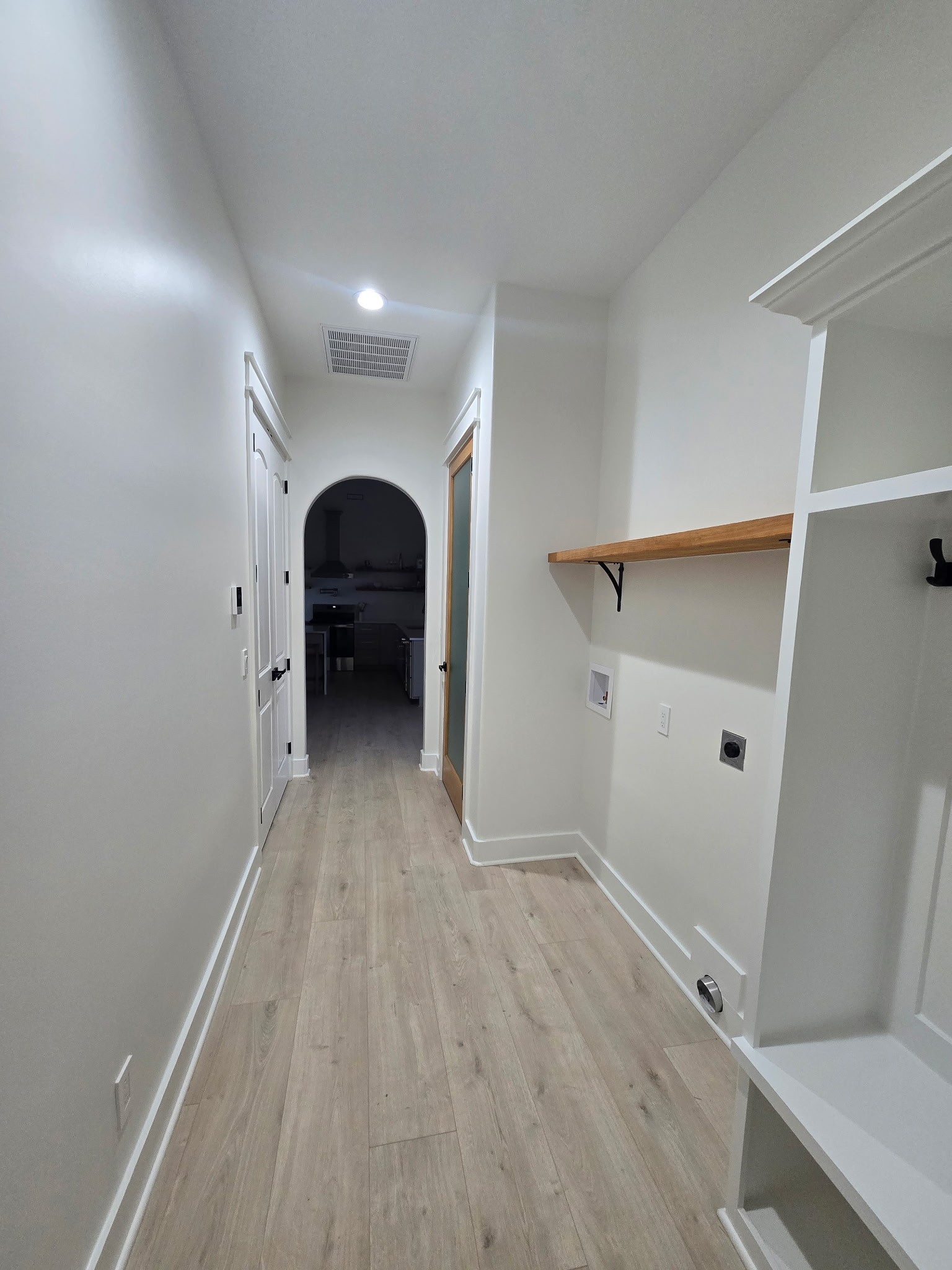6784 Shelbyville Road Morrison, TN 37357 - Photo 48 of 48 a view of a hallway view with wooden floor and staircase