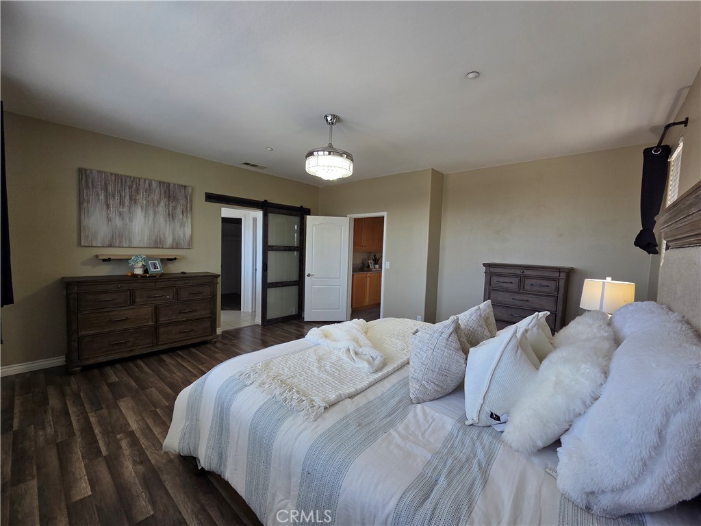 20329 Red Poppy Lane Riverside, CA 92508 - Photo 17 of 24 a bed room with a bed and a television