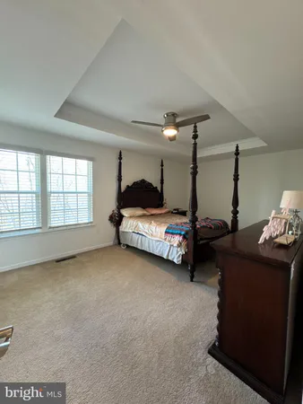 a bed room with furniture and a window