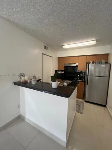 a view of a building with a yard