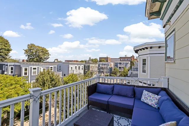 a view of a balcony with furniture