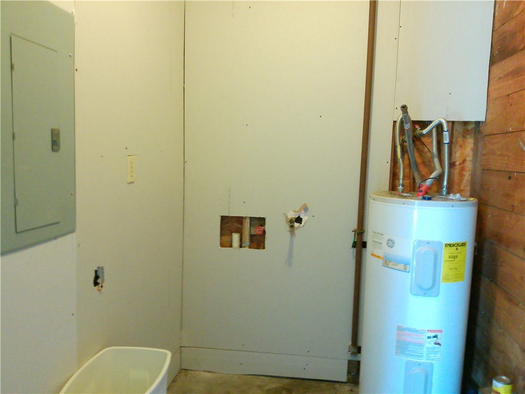 4006 McArdle Road Corpus Christi, TX 78411 - Photo 14 of 17 a bathroom with a toilet and a shower