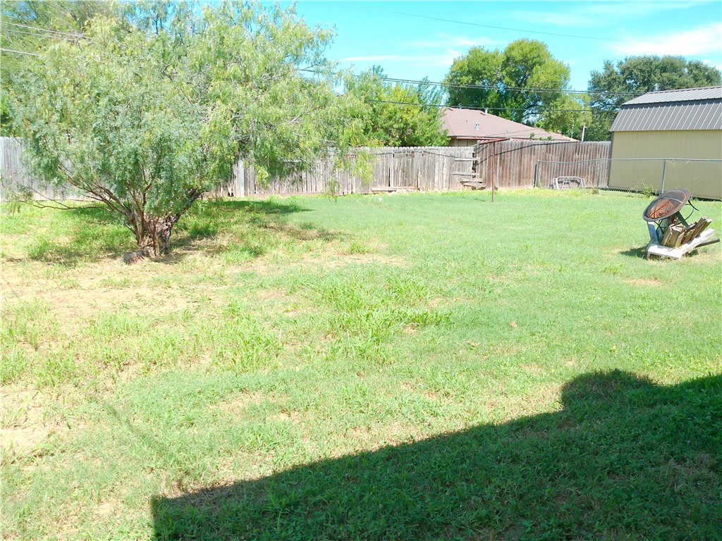 4006 McArdle Road Corpus Christi, TX 78411 - Photo 15 of 17 a view of a backyard with plants and large trees
