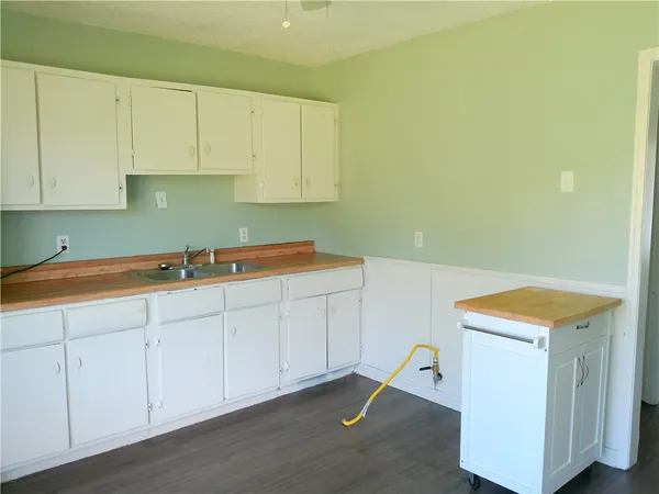 an empty room with wooden floor