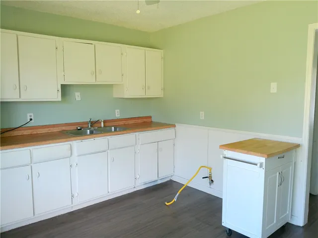 an empty room with wooden floor