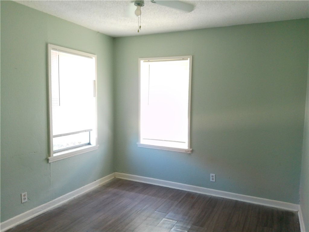 4006 McArdle Road Corpus Christi, TX 78411 - Photo 10 of 17 an empty room with a window