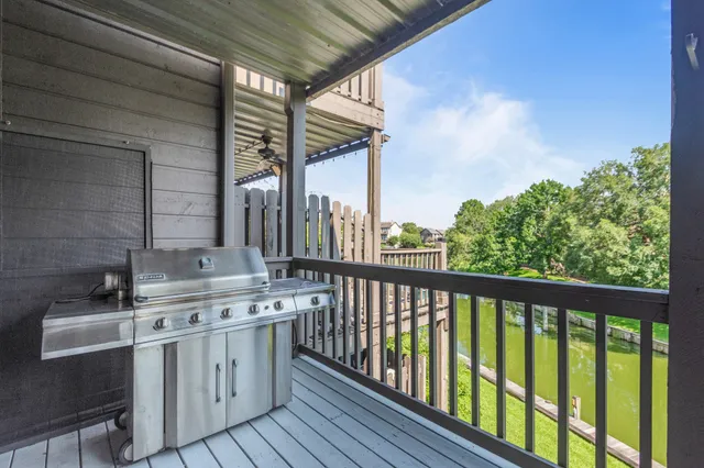 a kitchen with a stove a sink and cabinets