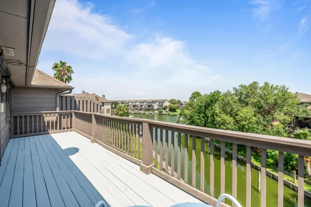 a view of balcony with wooden floor