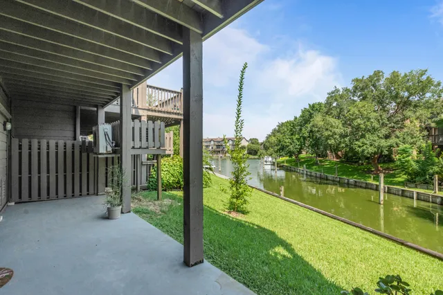 a view of a lake with a large trees