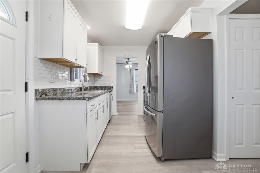 629 Storms Road Dayton, OH 45429 - Photo 25 of 51 This galley kitchen features ample cabinet space, modern appliances, and a seamless flow into adjacent living areas.