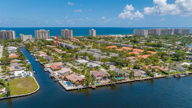 a view of a house with a floor to ceiling window and wooden floor