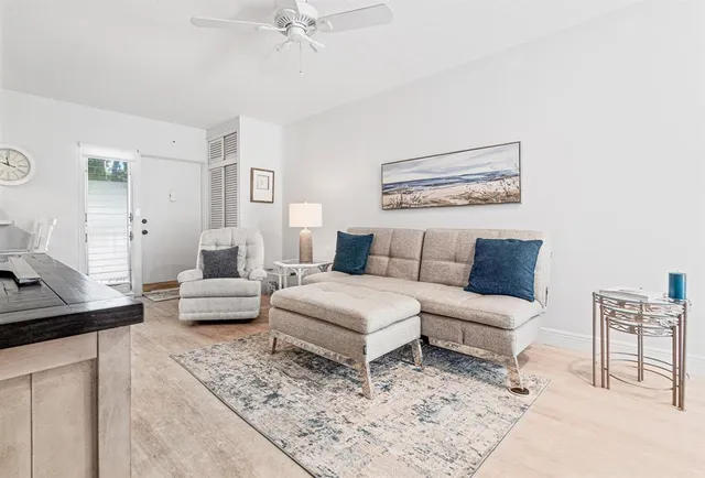 a living room with furniture and a rug
