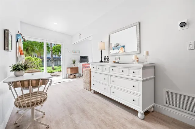 a room with a dresser and a chair