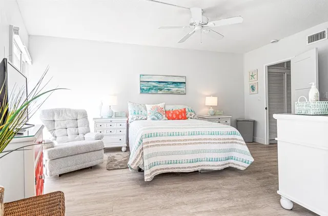 a bedroom with a bed and a couch