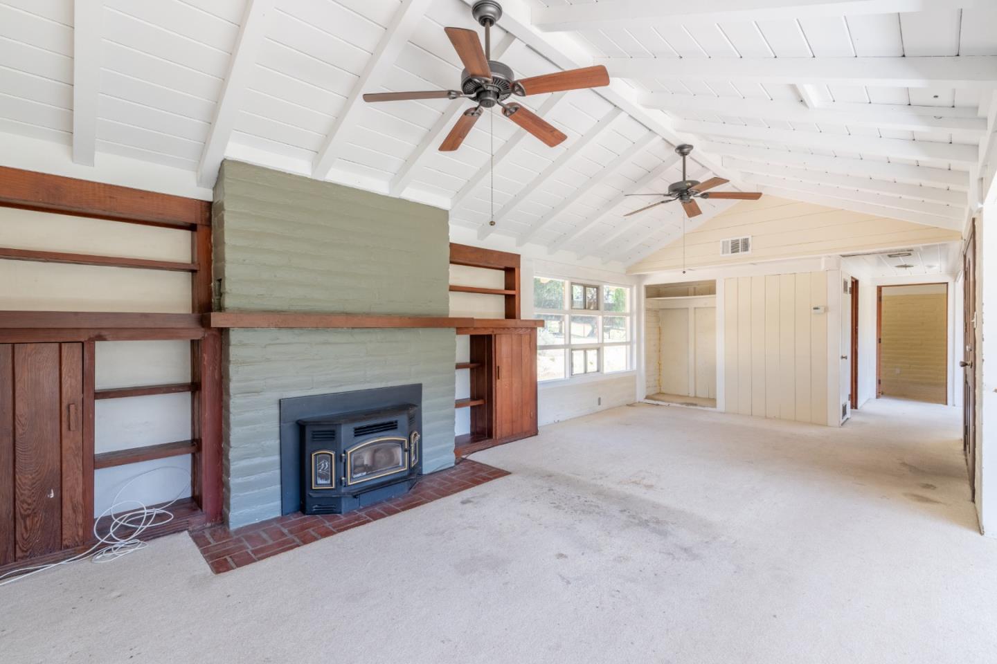 72 Los Laureles Grade Road Carmel Valley, CA 93924 - Photo 4 of 43 a view of a livingroom with a fireplace and window