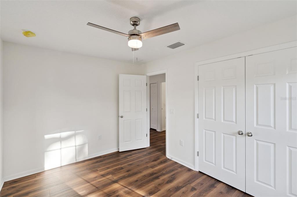 1075 North Rockingham Avenue Tavares, FL 32778 - Photo 13 of 16 a view of an empty room with wooden floor