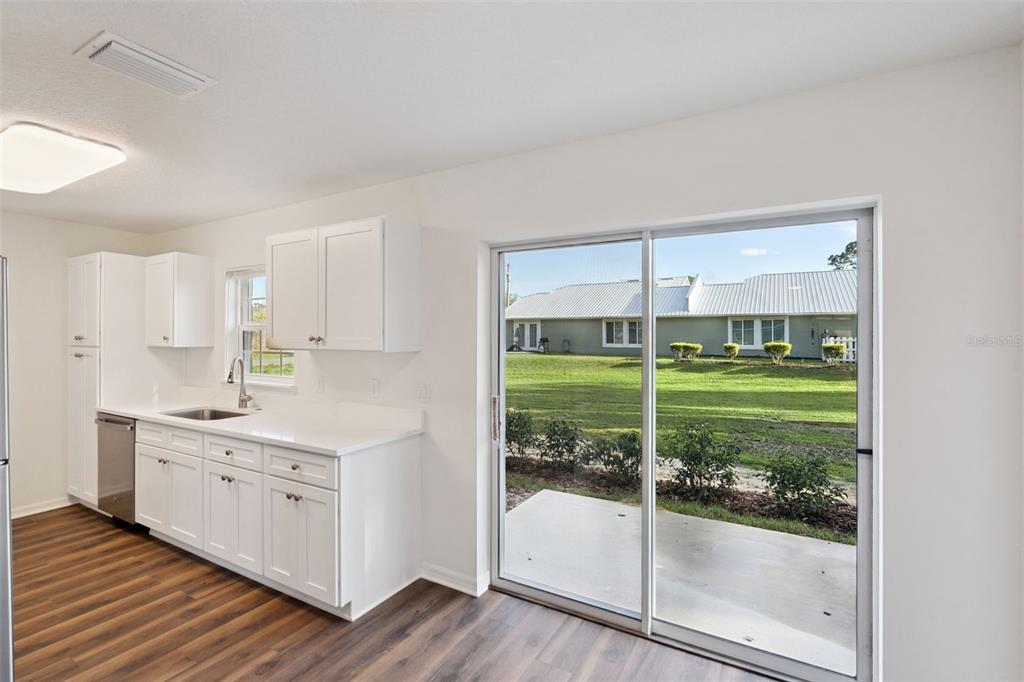 1075 North Rockingham Avenue Tavares, FL 32778 - Photo 5 of 16 a bathroom with a double vanity sink and tub