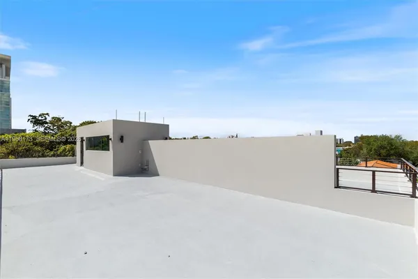 a view of a living room and a balcony